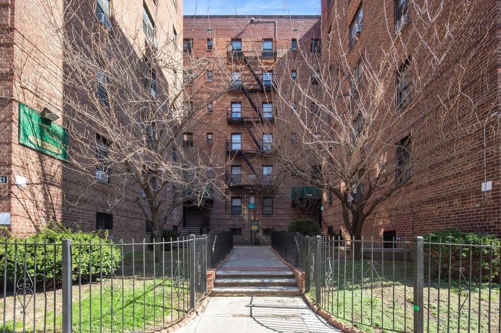 view of building exterior featuring fence