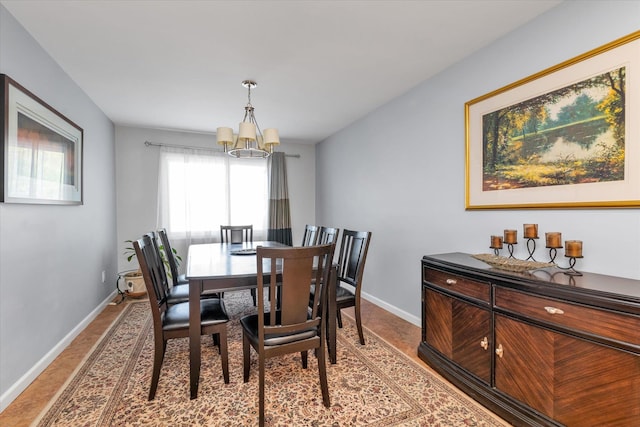 580 Foxhurst Rd, Baldwin, NY 11510 - dining room with a chandelier and baseboards