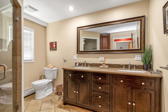 580 Foxhurst Rd, Baldwin, NY 11510 - full bathroom with toilet, tile patterned floors, baseboard heating, double vanity, and a shower