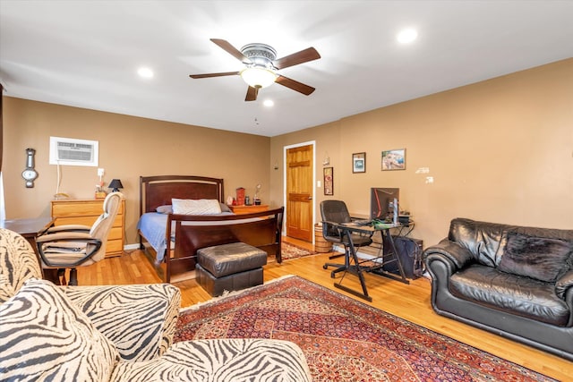 580 Foxhurst Rd, Baldwin, NY 11510 - bedroom featuring a wall unit AC, wood finished floors, a desk, recessed lighting, and a ceiling fan