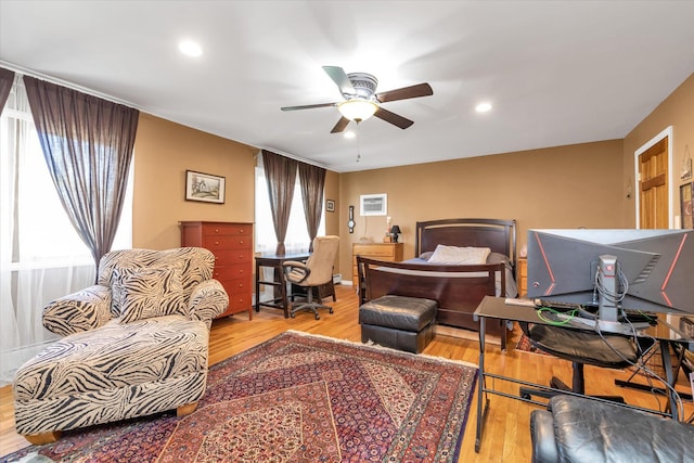 580 Foxhurst Rd, Baldwin, NY 11510 - bedroom with wood finished floors, an AC wall unit, multiple windows, and recessed lighting