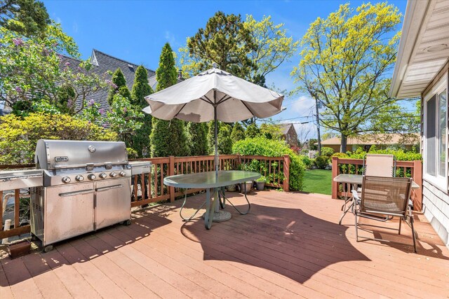 580 Foxhurst Rd, Baldwin, NY 11510 - wooden deck with outdoor dining space and a grill