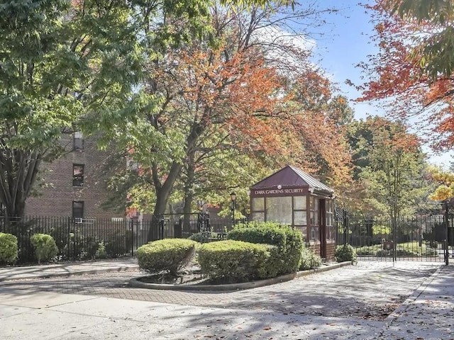 view of property's community featuring fence
