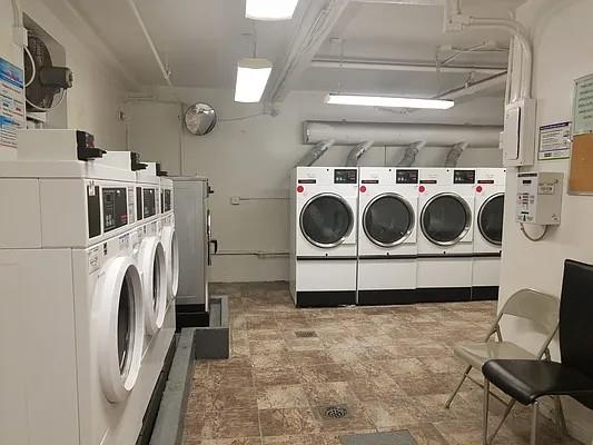 community laundry room with washing machine and dryer