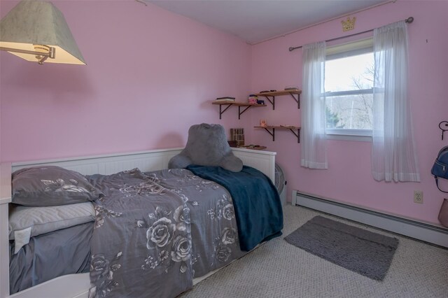 carpeted bedroom with wainscoting and baseboard heating