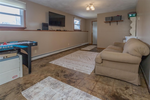 living area featuring baseboards and baseboard heating