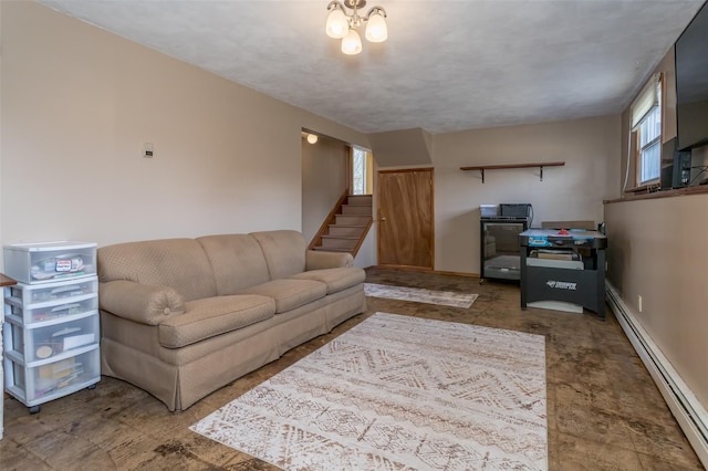 living area featuring a healthy amount of sunlight, stairway, and baseboard heating