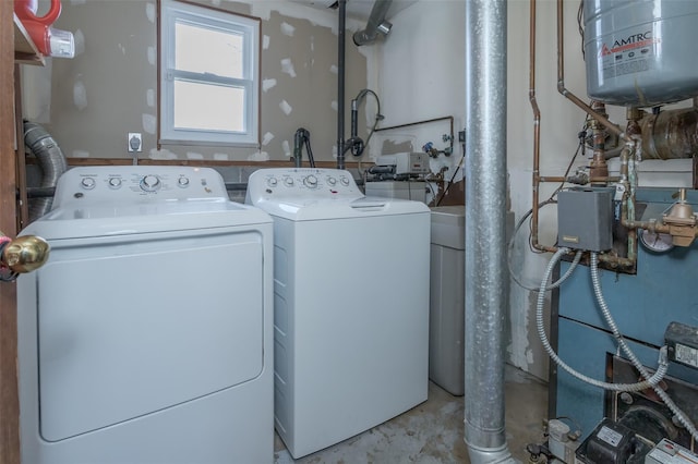 washroom with washing machine and clothes dryer and laundry area