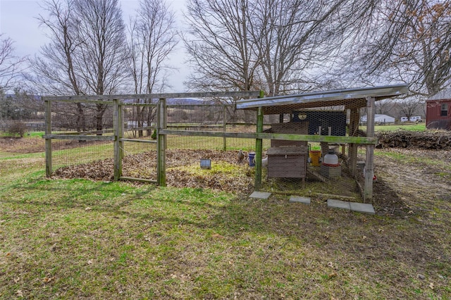 view of yard featuring exterior structure and an outbuilding