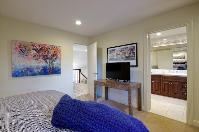 65 Elm Dr, East Hills, NY 11576 - bedroom with light colored carpet, recessed lighting, a sink, ensuite bathroom, and light tile patterned floors