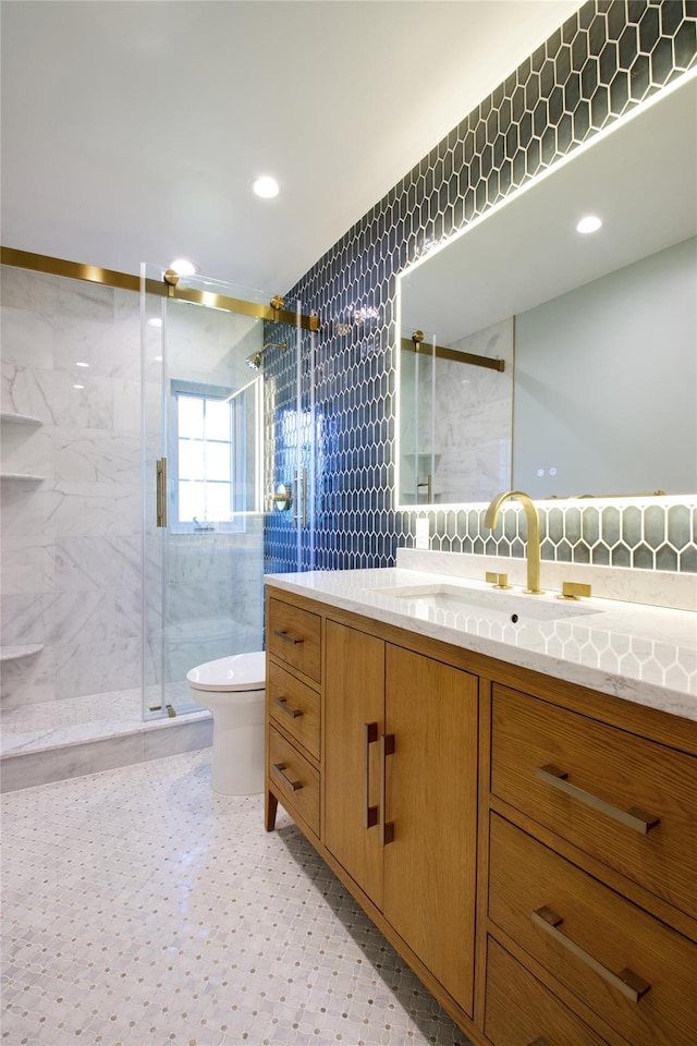 65 Elm Dr, East Hills, NY 11576 - full bath featuring toilet, a marble finish shower, vanity, tile walls, and decorative backsplash