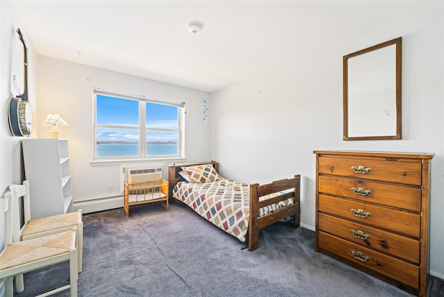 carpeted bedroom featuring baseboard heating, a wall mounted air conditioner, and baseboards