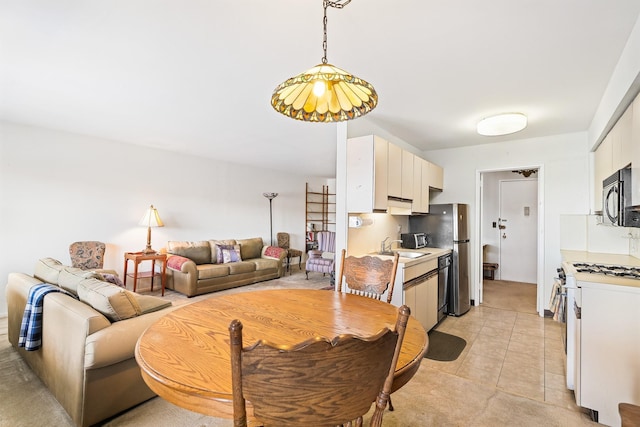 dining space with light tile patterned floors