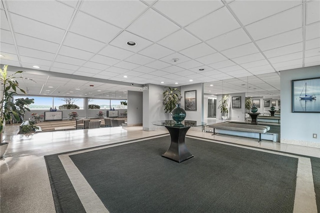 exercise area featuring a drop ceiling