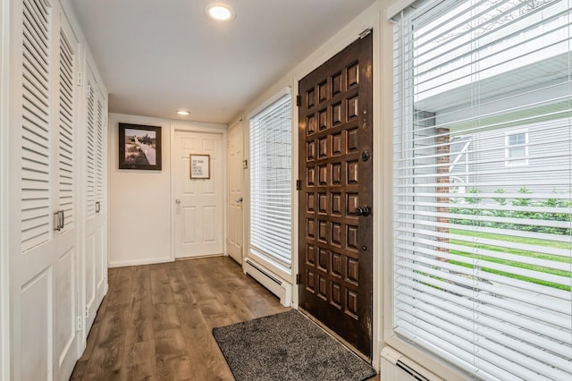 200 Block Ln, Island Park, NY 11558 - foyer entrance featuring a baseboard radiator, dark wood-style flooring, and recessed lighting