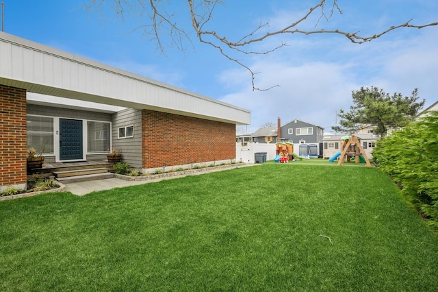 200 Block Ln, Island Park, NY 11558 - view of yard featuring a playground