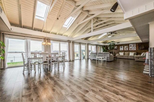 200 Block Ln, Island Park, NY 11558 - dining space with a skylight, a chandelier, wood finished floors, and ceiling fan