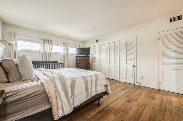 200 Block Ln, Island Park, NY 11558 - bedroom featuring wood finished floors and two closets