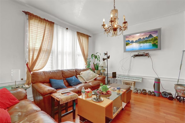 living room with a notable chandelier and hardwood / wood-style floors