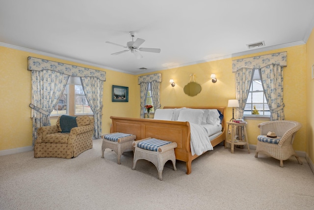 carpeted bedroom with a ceiling fan, baseboards, visible vents, and ornamental molding