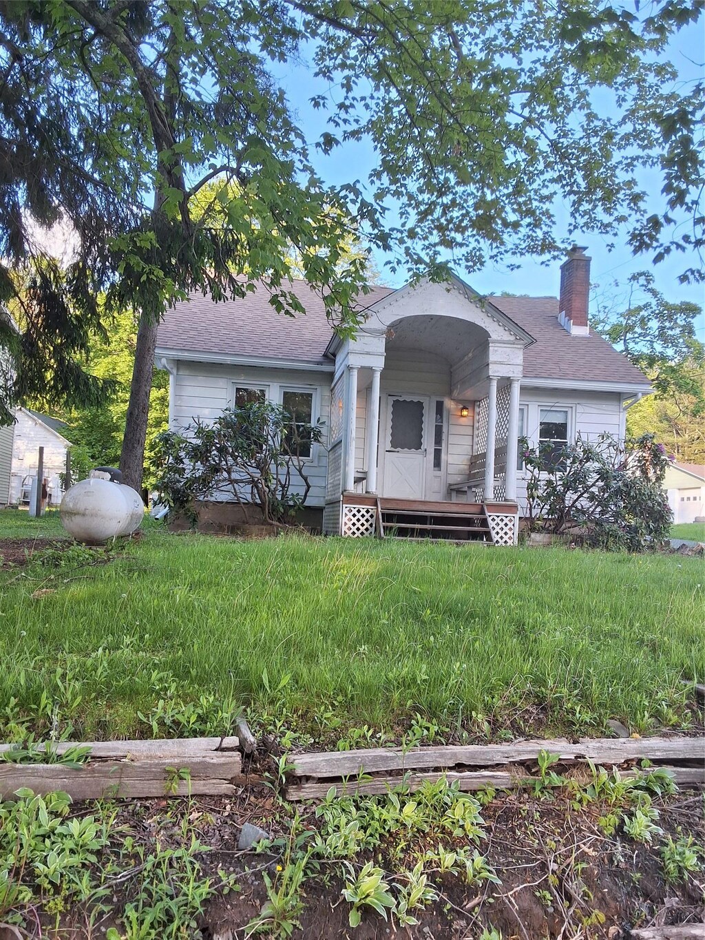 6222 State Route 42, Fallsburg, NY 12733 - view of front of house with a chimney and roof with shingles