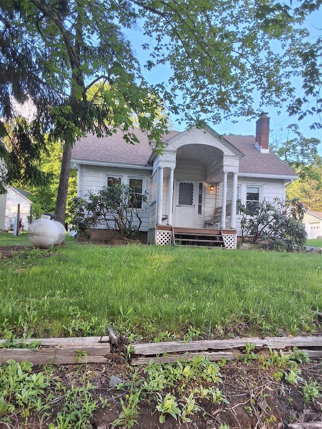6222 State Route 42, Fallsburg, NY 12733 - view of front of house with a chimney and roof with shingles