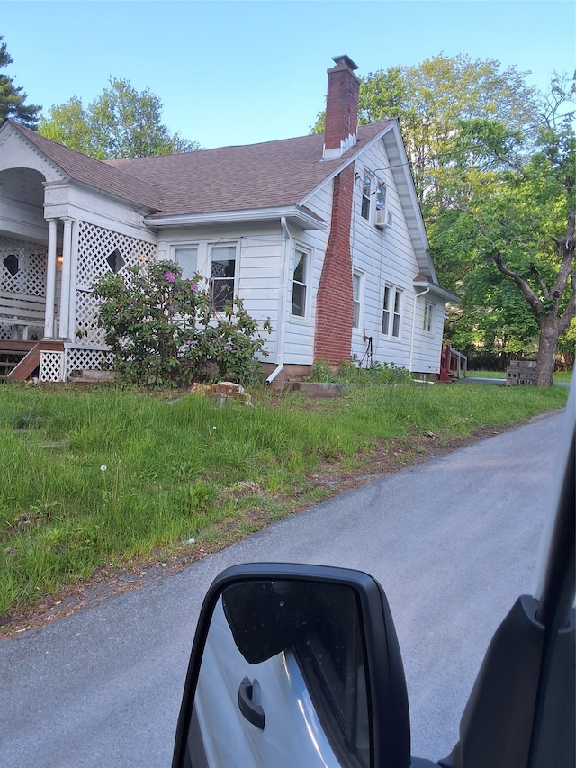 6222 State Route 42, Fallsburg, NY 12733 - view of side of property featuring a chimney and roof with shingles