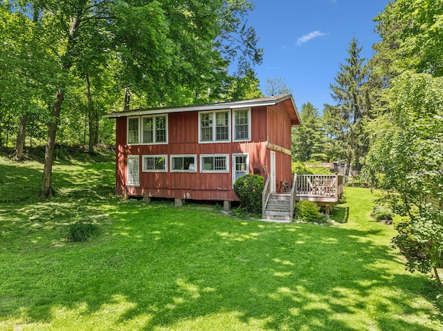 27 Powder Mill Rd, Newburgh, NY 12550 - back of property featuring a wooden deck and a lawn