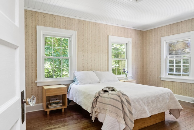 27 Powder Mill Rd, Newburgh, NY 12550 - bedroom featuring multiple windows, dark wood-type flooring, wallpapered walls, and baseboards