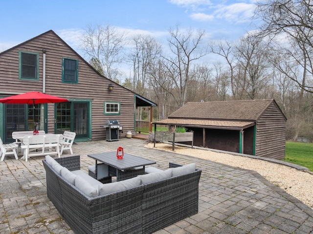 view of patio / terrace with outdoor dining area, a grill, and an outdoor hangout area