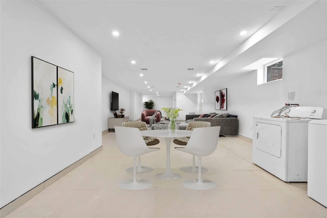 76-17 162nd St, Fresh Meadows, NY 11366 - dining area with baseboards, washing machine and dryer, recessed lighting, and light tile patterned flooring