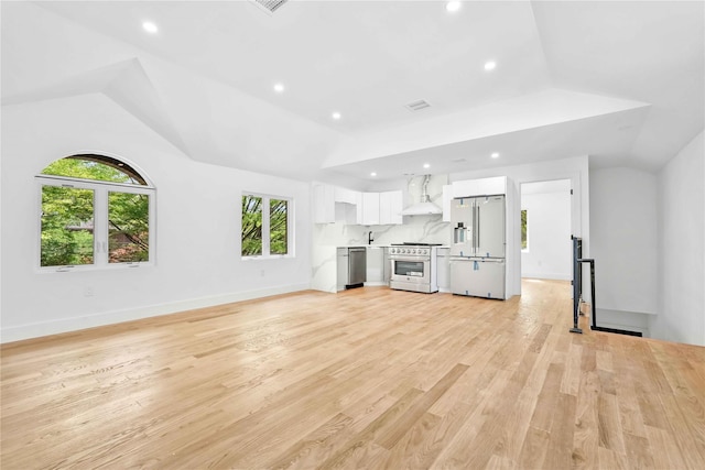 76-17 162nd St, Fresh Meadows, NY 11366 - unfurnished living room with light wood-type flooring, recessed lighting, and lofted ceiling