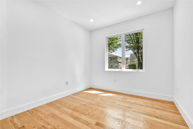76-17 162nd St, Fresh Meadows, NY 11366 - empty room with baseboards, recessed lighting, and wood finished floors