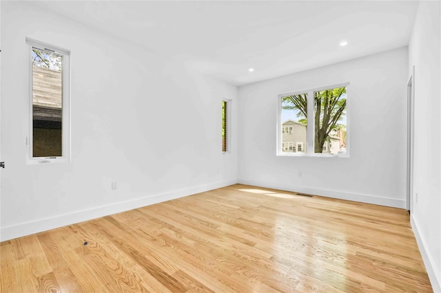 76-17 162nd St, Fresh Meadows, NY 11366 - unfurnished room with recessed lighting, baseboards, visible vents, and wood finished floors