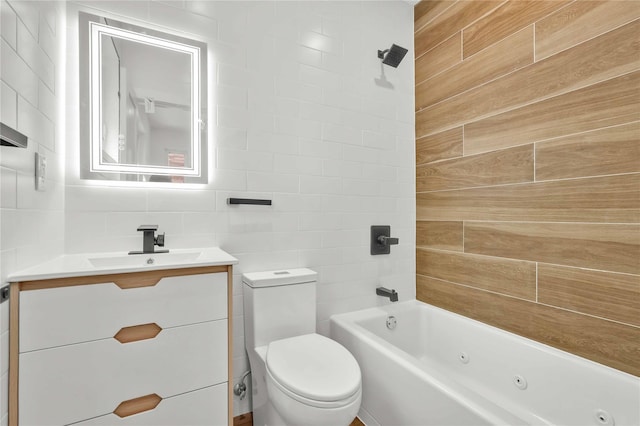 76-17 162nd St, Fresh Meadows, NY 11366 - bathroom with vanity, a combined bath / shower with jetted tub, toilet, and tile walls