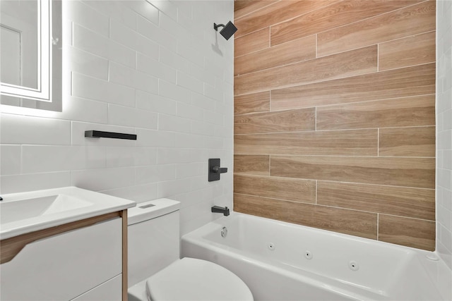 76-17 162nd St, Fresh Meadows, NY 11366 - bathroom with vanity, a combined bath / shower with jetted tub, toilet, and tile walls