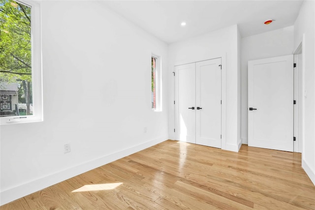 76-17 162nd St, Fresh Meadows, NY 11366 - unfurnished bedroom featuring baseboards, recessed lighting, and light wood-style flooring