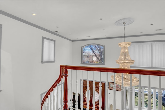 corridor featuring an inviting chandelier, recessed lighting, ornamental molding, and visible vents