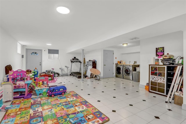 game room featuring washing machine and dryer and visible vents