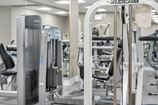 workout area featuring arched walkways