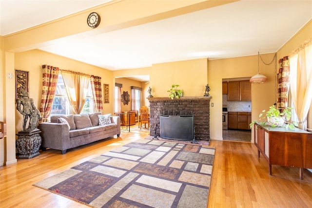 675 N Oakwood Rd, Laurel, NY 11948 - living room with a fireplace and light wood-type flooring