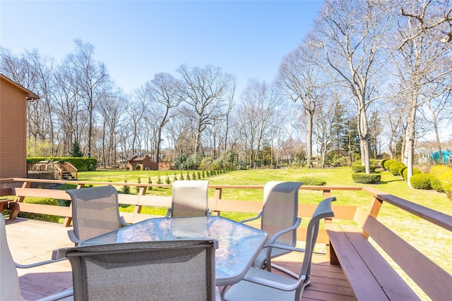 675 N Oakwood Rd, Laurel, NY 11948 - wooden terrace with a lawn and outdoor dining area