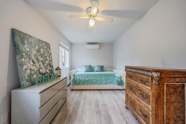 19 Hillside Ave, Northport, NY 11768 - bedroom featuring a wall unit AC, light wood-type flooring, and a ceiling fan