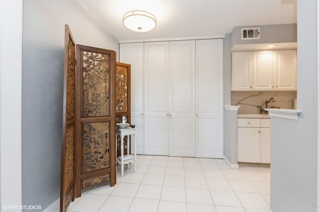 interior space with visible vents and cabinet space