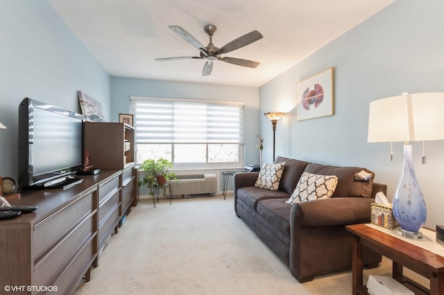 living area with light colored carpet and a ceiling fan