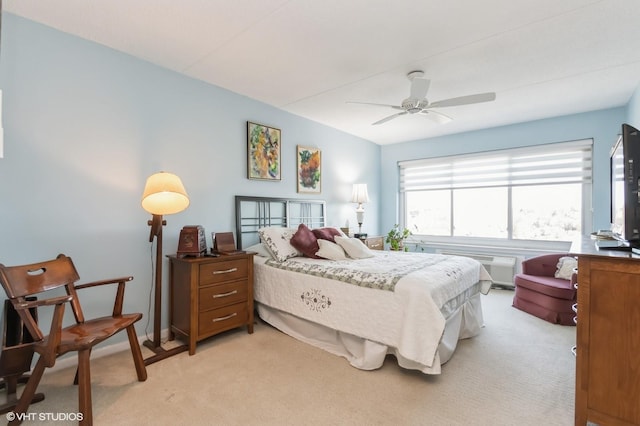 bedroom with light carpet and ceiling fan