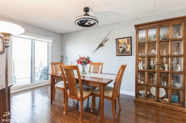 dining area with dark wood-style floors