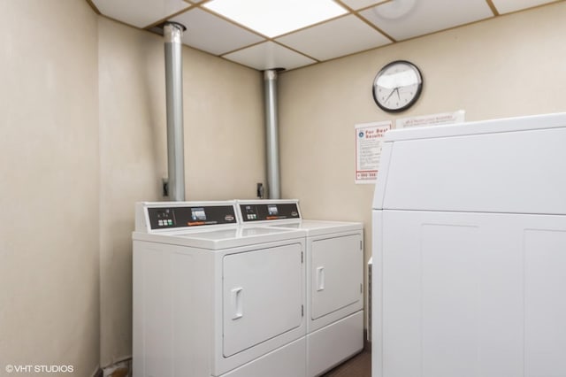 common laundry area featuring separate washer and dryer