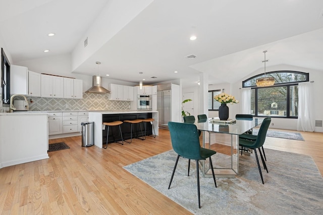 45 Nichols Rd, Huntington Station, NY 11746 - dining area featuring recessed lighting, visible vents, lofted ceiling, and light wood-type flooring