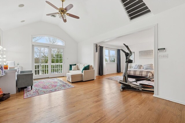 45 Nichols Rd, Huntington Station, NY 11746 - workout room with light wood-style flooring, visible vents, baseboards, ceiling fan, and vaulted ceiling